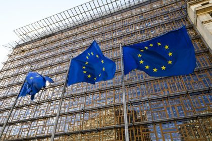 European Union flags outside EU headquarters during Iran sanctions announcement
