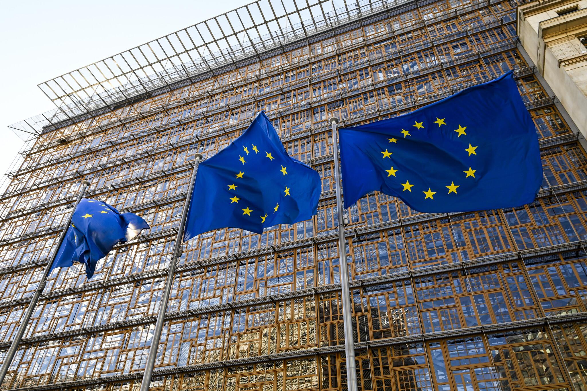 European Union flags outside EU headquarters during Iran sanctions announcement
