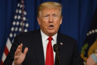 Close up portrait of Donald Trump with a serious expression during a press appearance.