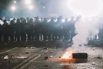 burning cars seen during civil unrest violence