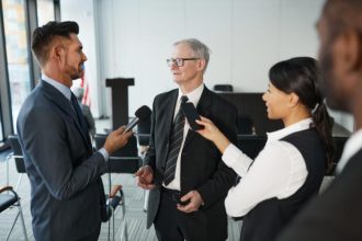 Media coverage for business as executives participate in a professional news interview