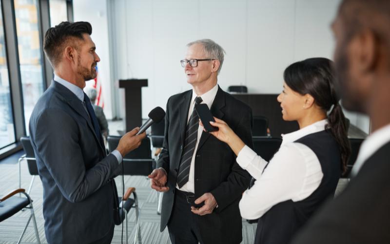 Media coverage for business as executives participate in a professional news interview