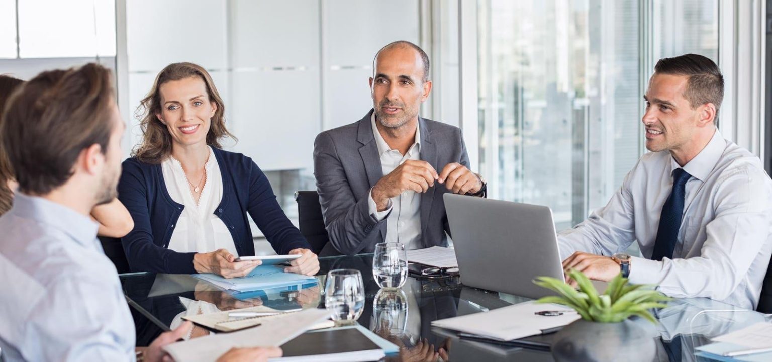 Investors discussing startup funding with a registered limited company highlighting limited company benefits