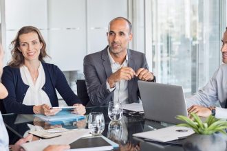 Investors discussing startup funding with a registered limited company highlighting limited company benefits