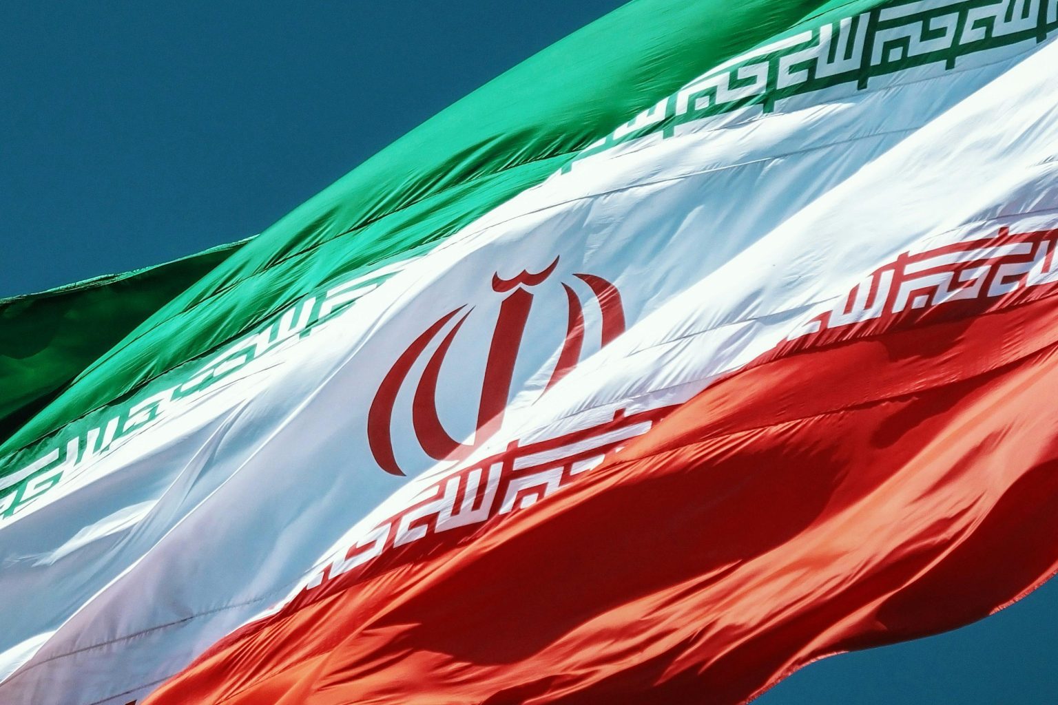 Iranian national flag representing Tehran's position during US–Iran peace talks.