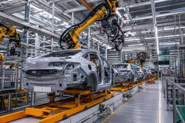 Vehicle manufacturing assembly line illustrating the impact of EU-China trade restrictions on European carmakers.