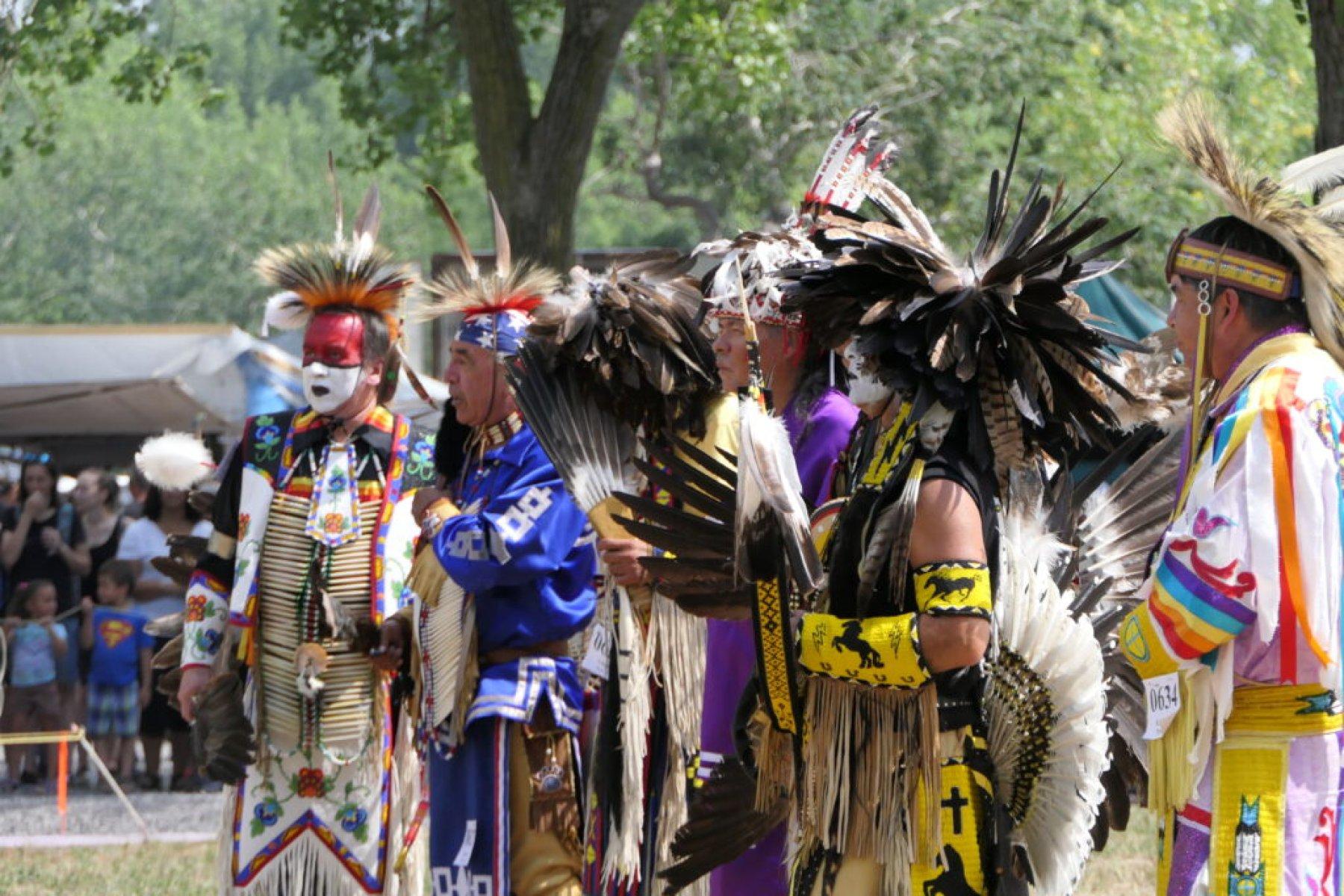 Mohawk Nation community members wearing traditional regalia during a cultural event