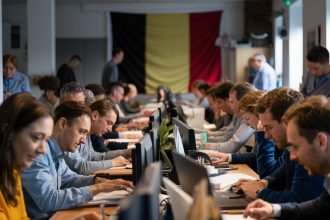 Belgian employee working in an office as workers face rules on reclaiming holiday days lost to illness