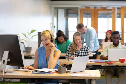 Customer service professionals supporting corporate reputation through quality business communication