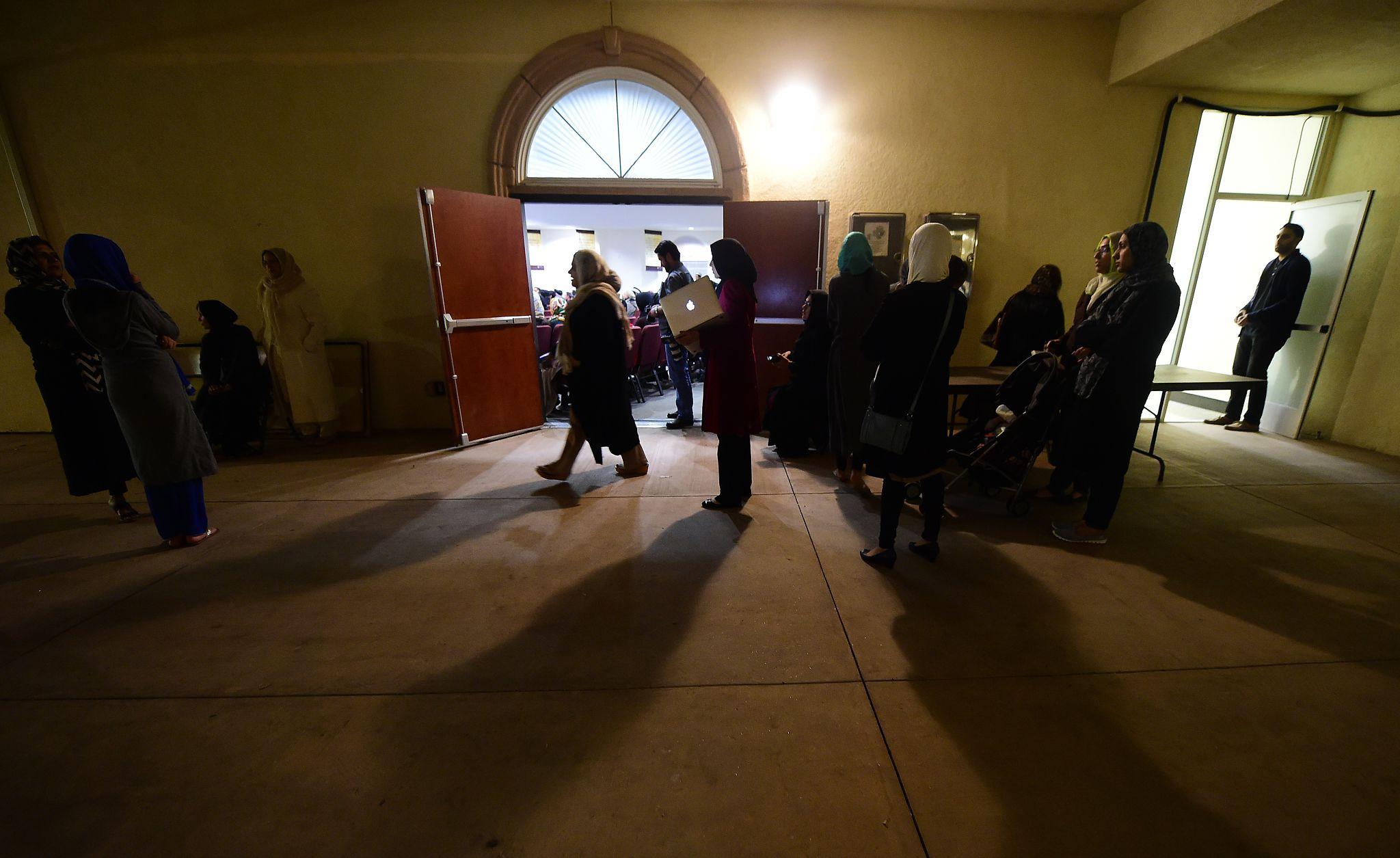 FBI mosque investigation agents reviewing evidence near mosque facility