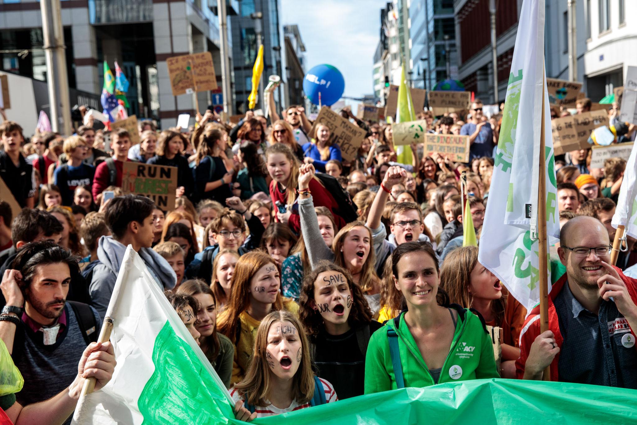 Brussels protests illustrated by a crowd of demonstrators marching through the Belgian capital during an earlier rally.