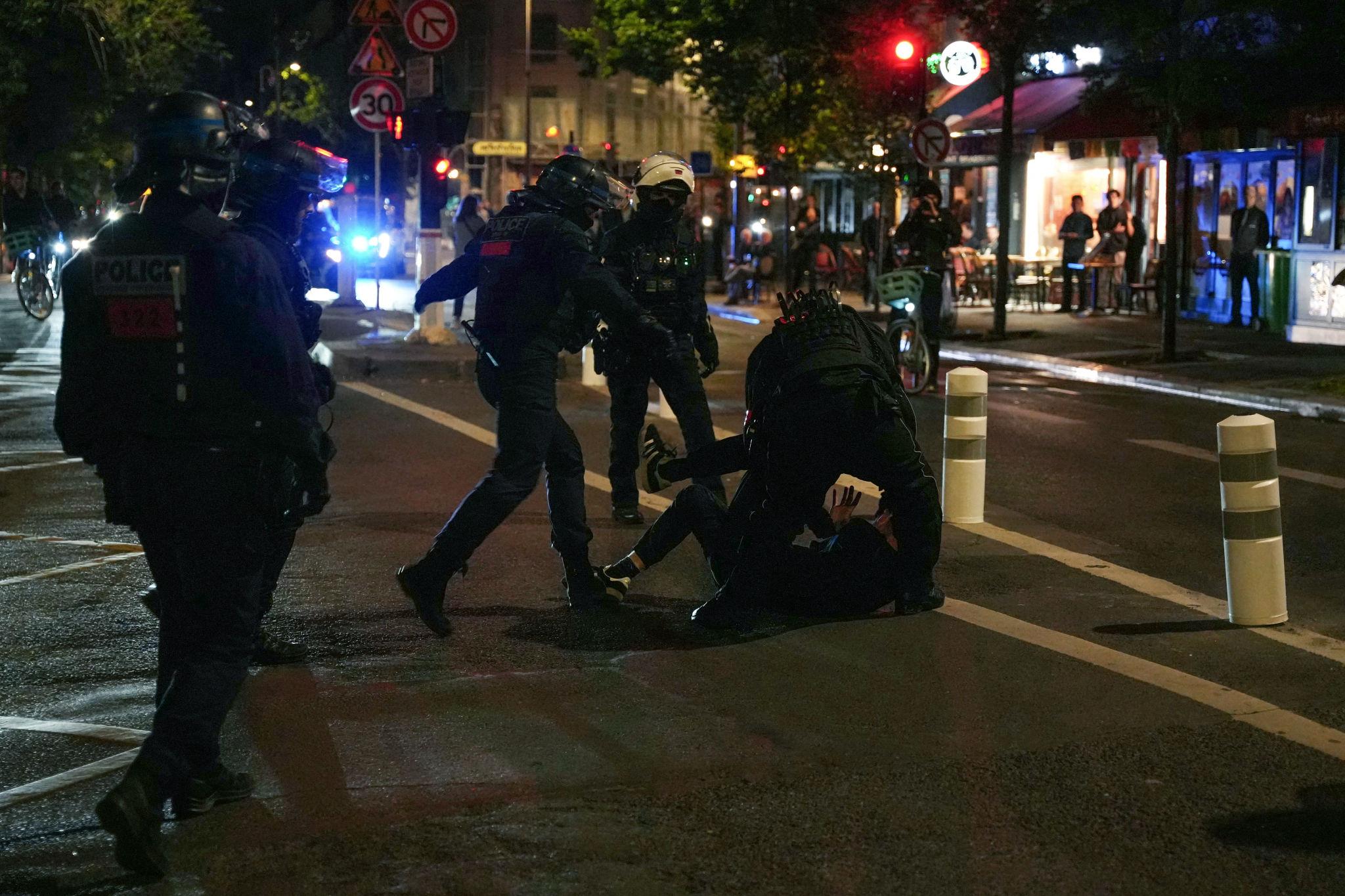 Europe breaking news: French police detain demonstrators during a banned Iran opposition rally in Paris, France, June 2026