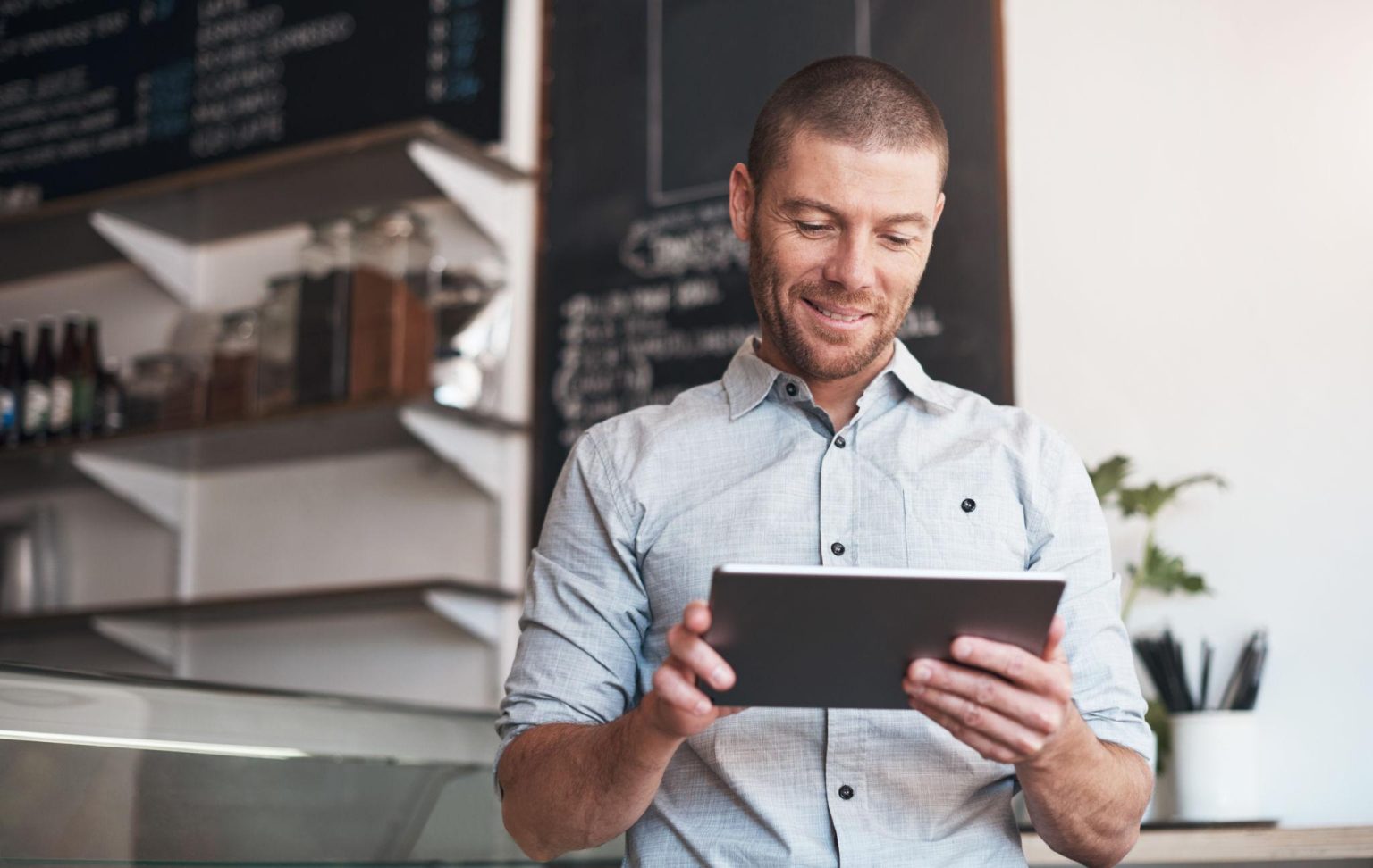 Business owner reviewing customer testimonials to improve customer satisfaction and reputation