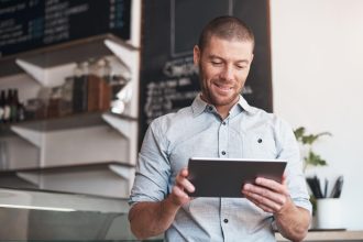 Business owner reviewing customer testimonials to improve customer satisfaction and reputation