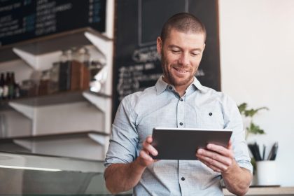 Business owner reviewing customer testimonials to improve customer satisfaction and reputation