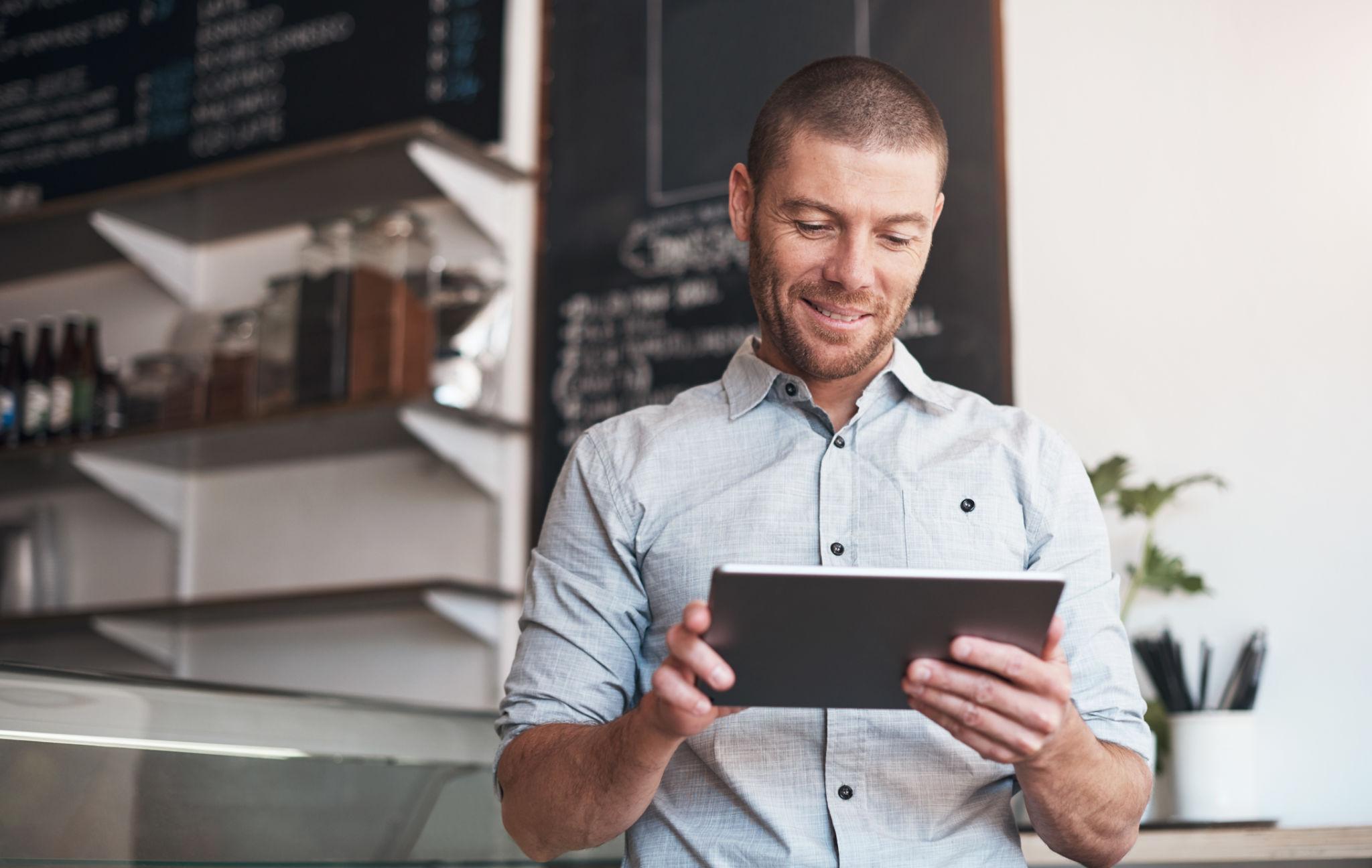 Business owner reviewing customer testimonials to improve customer satisfaction and reputation