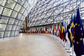 EU Ukraine sanctions extended as Ukrainian and European Union flags fly in Brussels