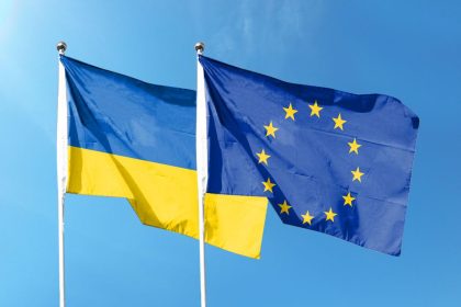 Ukrainian and European Union flags symbolising EU Ukraine Support and European cooperation.