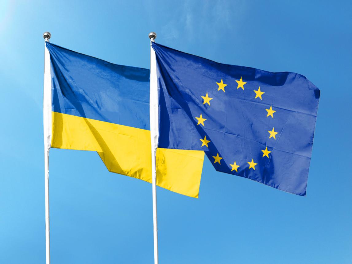 Ukrainian and European Union flags symbolising EU Ukraine Support and European cooperation.