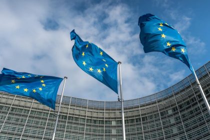 EU–Canada membership proposal faces opposition as European Union flags fly outside the European Commission in Brussels.