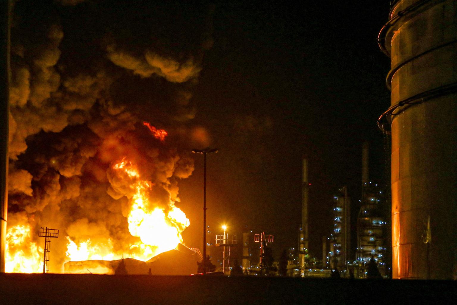 Thick smoke rises over Tehran after Tehran oil depots attack damages energy infrastructure