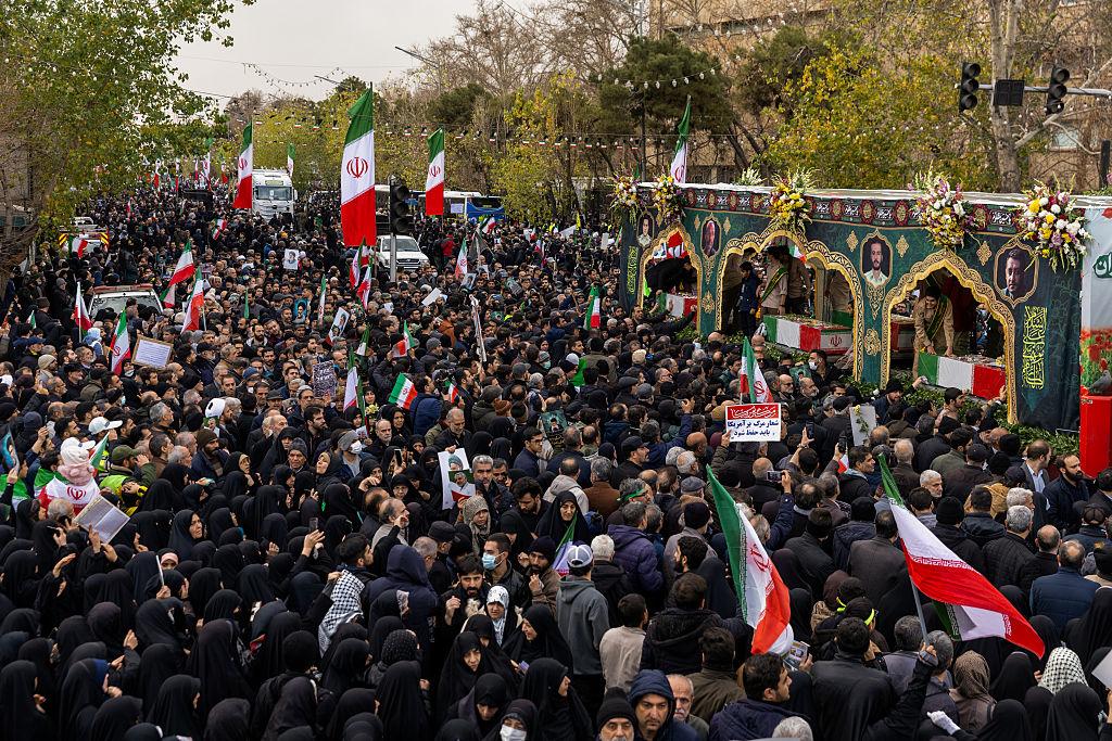 Iran funeral security chiefs procession with flag draped coffins and honor guard