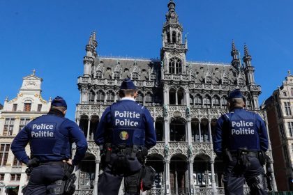 Police officers at Brussels Grand Place as Belgium debates public security measures.