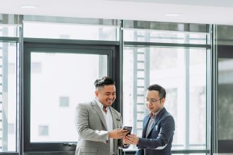Marketing professionals planning an SEO and public relations strategy to improve online reputation