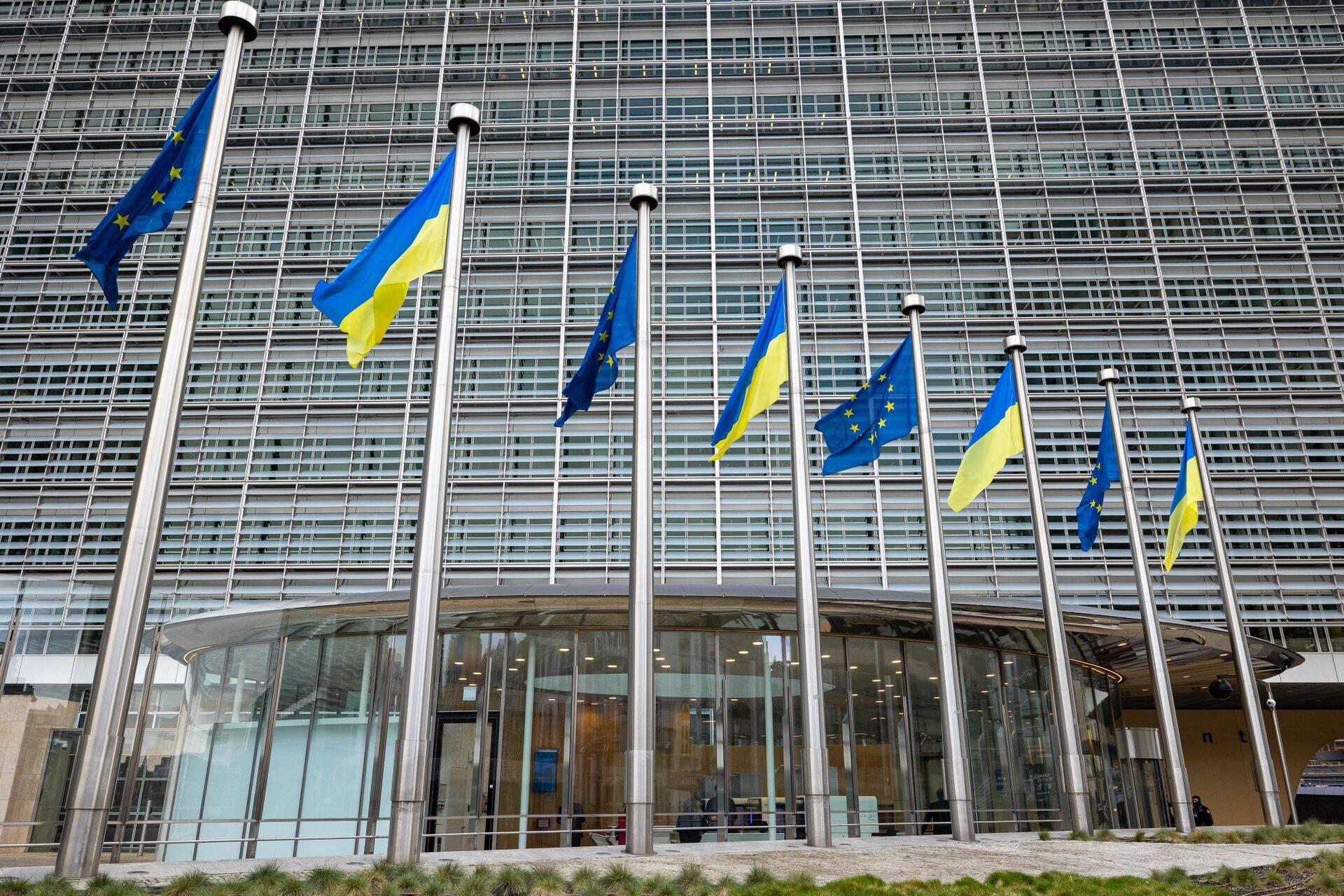 Ukraine EU payment conditions as Ukrainian flag flies outside European Commission in Brussels