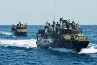 energy security crisis impacting Strait of Hormuz oil route