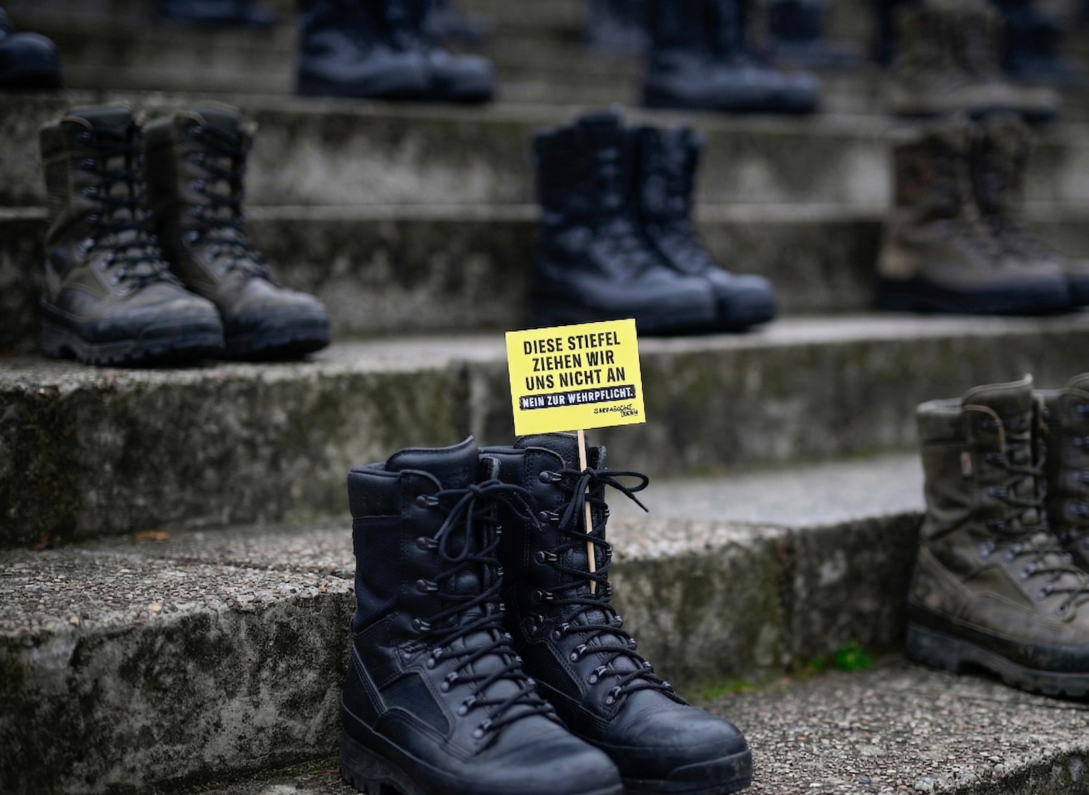 Men applying for military approval during protests in Germany