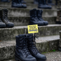 Men applying for military approval during protests in Germany