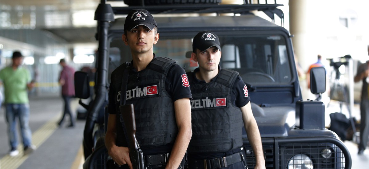 Turkish police security managing crowd control near diplomatic site