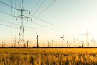 Wind turbines and electricity infrastructure illustrating EU Energy Relief and European energy security.