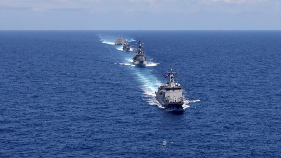 China military expansion featuring modern naval vessels operating in Asian waters