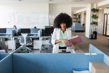 Business record management with organised company files in a modern UK office