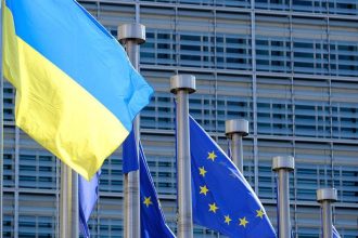 Ukraine funding gap draws attention to European Union assistance as Ukrainian and EU flags fly in Brussels.