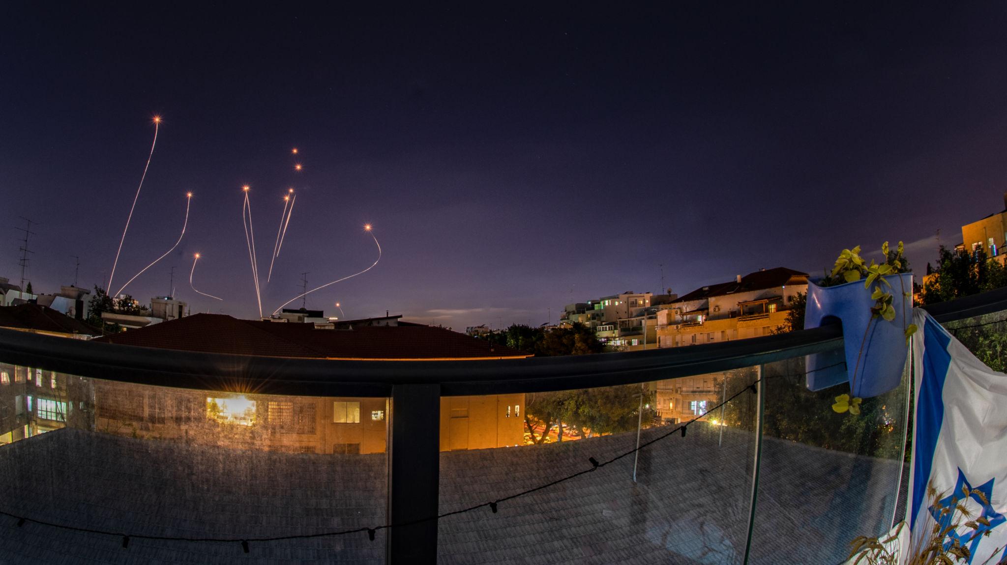 Israel defense response intercepting incoming rockets with advanced air defense technology