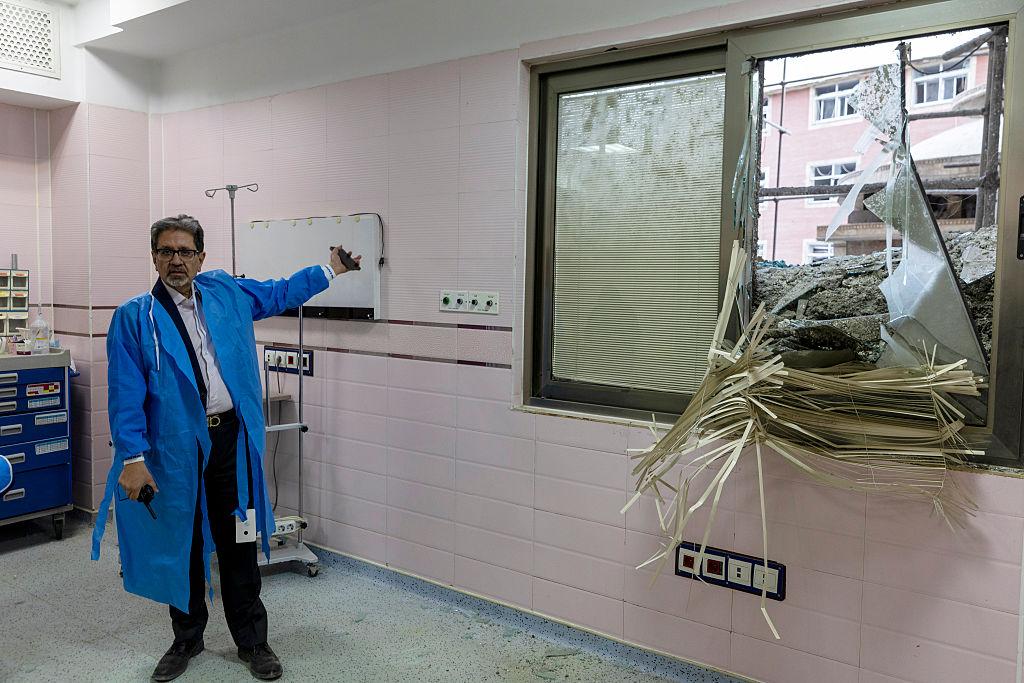 Emergency crews inspect Iran hospitals damaged after nearby airstrikes