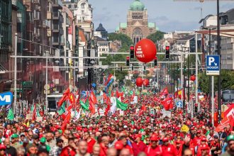 Brussels riots news illustrated by a crowd attending a previous political demonstration in the Belgian capital.