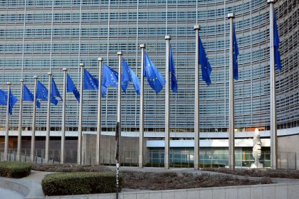 EU-China trade breakthrough and European Union flags outside the European Commission building in Brussels.